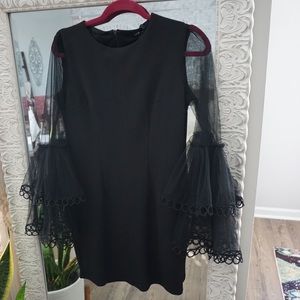Black fitted dress with sheer bell sleeves